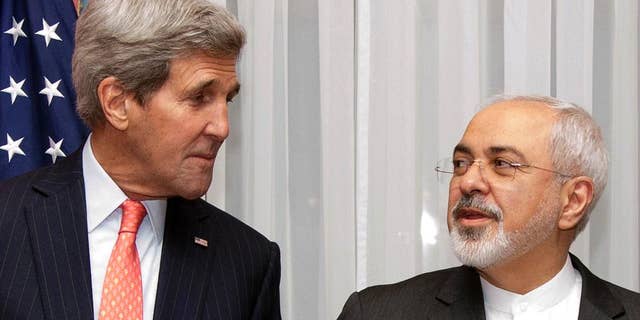 FILE - In this March 16, 2015 file photo U.S. Secretary of State John Kerry, left, listens to Iran's Foreign Minister Mohammad Javad Zarif, right, before resuming talks over Iran's nuclear program in Lausanne, Switzerland. The State Department said Kerry and Iran's Foreign Minister Mohammad Javad Zarif would meet Monday, April 27, 2015 at the United Nations on the sidelines of a conference on the nuclear non-proliferation treaty in which both men are participating. (AP Photo/Brian Snyder, Pool, File)