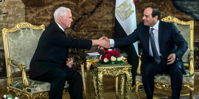 U.S. Vice President Mike Pence shakes hands with Egyptian President Abdel-Fattah el-Sissi, right, at the Presidential Palace in Cairo, Egypt, Saturday, Jan. 20, 2018.