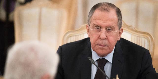 Russian Foreign Minister Sergey Lavrov listens to his Syrian counterpart Walid Muallem during their meeting in Moscow, Russia, on Thursday, April 13, 2017.   Lavrov said he expected the OPCW ( Organization for the Prohibition of Chemical Weapons ) to conduct an extensive probe into the suspected nerve gas attack on Khan Sheikhoun, Syria, which could produce a report  within about three weeks, the British delegation to the commission said Thursday. (AP Photo/Pavel Golovkin)