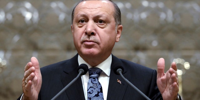 Turkey's President Recep Tayyip Erdogan addresses local administrators at his palace as the parliament continue to debate proposed amendments to the country's constitution that would hand Erdogan's largely ceremonial presidency sweeping executive powers, in Ankara, Turkey, Thursday, Jan. 19, 2017. Legislators on Thursday resume their deliberations on the proposed amendments which last week resulted in brawls between ruling and opposition party lawmakers. (Yasin Bulbul, Presidential Press Service, Pool Photo via AP)