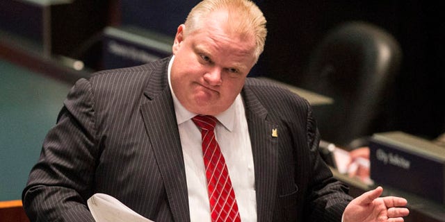 Nov. 18, 2013: Toronto Mayor Rob Ford attends a council meeting as councilors look to pass motions to limit his powers in Toronto.