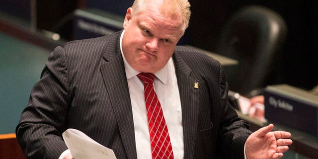Nov. 18, 2013: Toronto Mayor Rob Ford attends a council meeting as councilors look to pass motions to limit his powers in Toronto.