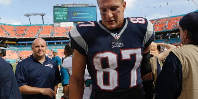 New England Patriots tight end Rob Gronkowski (87) walks off the field after the Patriots were defeated by the Miami Dolphins 33-20 in an NFL football game, Sunday, Sept. 7, 2014, in Miami Gardens, Fla. (AP Photo/Lynne Sladky)