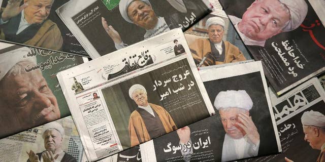 Front pages of the Monday, Jan. 9, 2017, edition of Iranian newspapers, published with pictures of former President Akbar Hashemi Rafsanjani, who died on Sunday after suffering a heart attack. Newspapers in Iran published front-page photographs of Rafsanjani, while state television aired archival clips of his comments and speeches. Mourners from all walks of life in Iran - from the country's president to passers-by on the street - paid their respects to him. The country is observing three days of mourning. (AP Photo/Vahid Salemi)