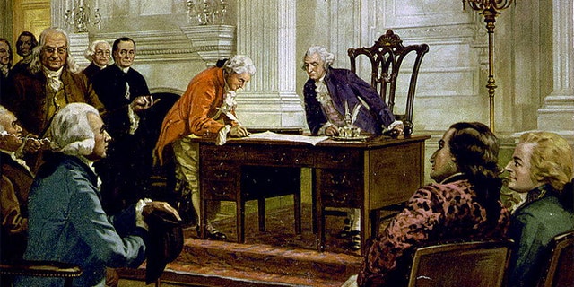 A reproduction of a painting of George Washington, Benjamin Franklin and others signing the U.S. Constitution in Philadelphia, Pennsylvania.