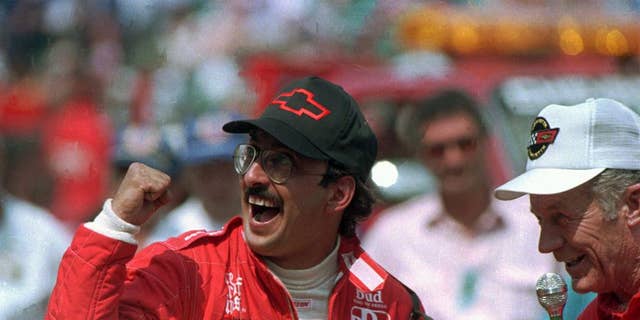 FILE - In this May 31, 1986 file photo, Bobby Rahal reacts after accepting the keys to the Chevrolet Corvette pace car after winning the 70th running of the Indianapolis 500 auto race in Indianapolis, Ind. (AP Photo/File)