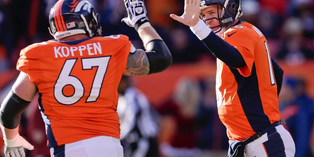 Denver Broncos quarterback Peyton Manning (18) gets a high five from Denver Broncos center Dan Koppen (67) after Manning threw a touchdown pass against the Cleveland Browns in the first quarter of an NFL football game, Sunday, Dec. 23, 2012, in Denver. (AP Photo/Joe Mahoney)