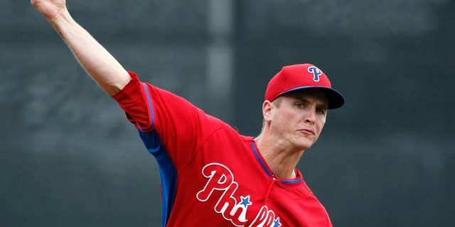 Philadelphia Phillies starting pitcher David Buchanan warms up prior to a spring exhibition baseball game against the Toronto Blue Jays in Dunedin, Fla., Monday, March 24, 2014. (AP Photo/Kathy Willens)