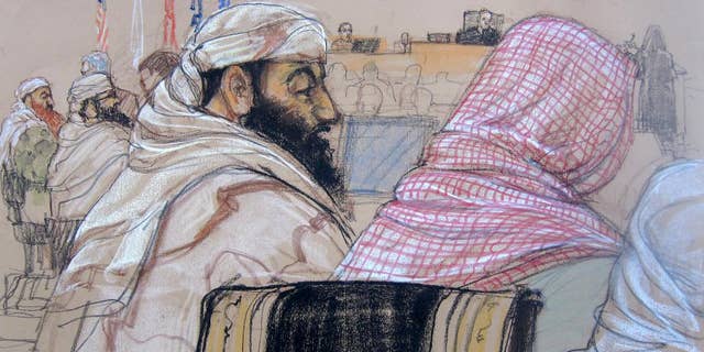In this pool photo of a Pentagon-approved sketch by court artist Janet Hamlin, defendant Ramzi Binalshibh, center, attends his pretrial hearing along with other defendants at the Guantanamo Bay U.S. Naval Base in Cuba, Monday, April 14, 2014. From right to left are Mustafa al Hawsawi, partially cut off, Ali Abdul Aziz Ali, Ramzi Binalshibh, Walid bin Attash and Khalid Sheikh Mohammad. A lawyer for one of five defendants in the Sept. 11 war crimes tribunal said Monday that FBI agents questioned a member of his defense team, apparently in an investigation related to the handling of evidence, a revelation that brought an abrupt halt to proceedings. The disclosure came at the start of what was supposed to be a mental competency hearing for Harrington's client, Ramzi Binalshibh, a Yemeni accused of providing logistical support to the Sept. 11, 2001, terrorist plot. (AP Photo/Janet Hamlin, Pool)