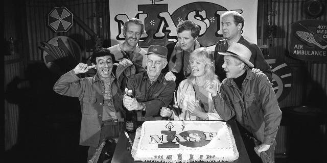 David Ogden Stiers is seen, top right, with other cast members of TV's "M*A*S*H," marking the show's 10th anniversary in 1981.