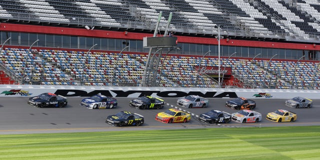 FILE - In this Jan. 11, 2013, file photo, a pack of cars drives past the start/finish line moments before a wreck on the backstretch during NASCAR auto race testing at Daytona International Speedway in Daytona Beach, Fla. There's a buzz about NASCAR and the season-opening Daytona 500 that has nothing to do with an exploding jet dryer or a well-timed tweet. NASCAR's new Gen-6 race car makes its long-awaited debut and the success of the 2013 season could depend heavily on its performance. (AP Photo/John Raoux, File)