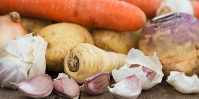 Winter seasonal vegetables collection including potatoes, parsnips, swede and carrots