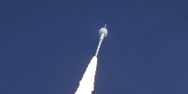 A bow shock forms around the Ares I-X test rocket traveling at supersonic speed during its Oct. 28, 2009 launch from the Kennedy Space Center, Fla.