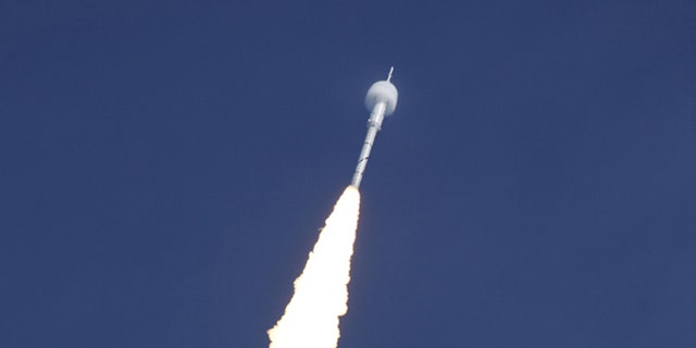 A bow shock forms around the Ares I-X test rocket traveling at supersonic speed during its Oct. 28, 2009 launch from the Kennedy Space Center, Fla.