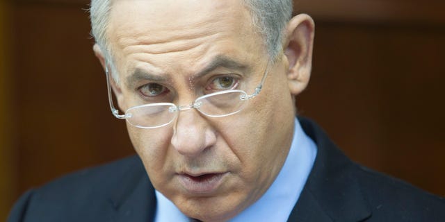 Israeli Prime Minister Benjamin Netanyahu attends the weekly cabinet meeting in his Jerusalem office, Sunday, Dec. 23, 2012. (AP Photo/Sebastian Scheiner, Pool)
