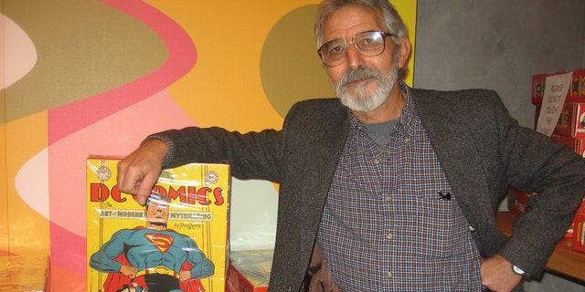 Comic book artist José Luís García-López with the supersized, Eisner-winning "75 Years of DC Comics: The Art of Modern Mythmaking"