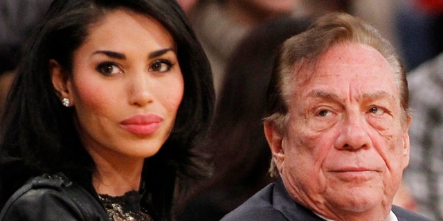 Donald Sterling and V. Stiviano in a December 2010 file photo