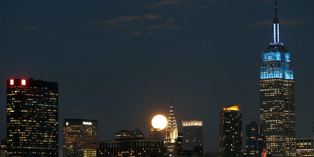 Feb. 7: A full moon rises between the Chrysler Building and the Empire State Building.