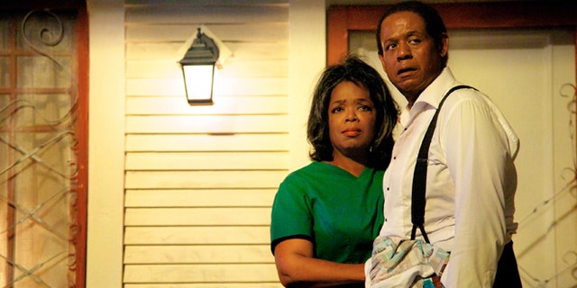 This film image released by The Weinstein Company shows Oprah Winfrey as Gloria Gaines, left, and Forest Whitaker as Cecil Gaines in a scene from Lee Daniels' "The Butler."