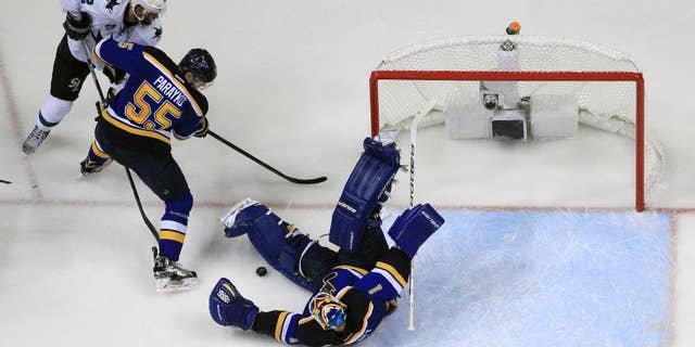 May 15, 2016: St. Louis Blues goalie Brian Elliott (1) makes the save as San Jose Sharks center Patrick Marleau (12) and the Blues defenseman Colton Parayko (55) battle for the puck during the third period in Game 1 of the NHL Western Conference finals in St. Louis