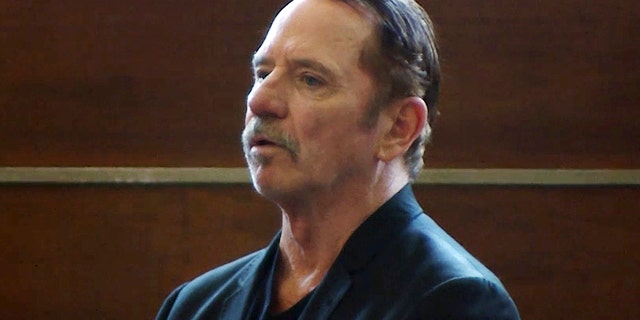 In this Aug. 3, 2017 file frame from video, actor Tom Wopat stands during arraignment in Waltham, Mass., on indecent assault and battery and drug possession charges.