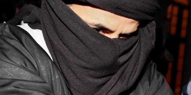 FILE - In this Monday, March, 15, 2010 file photo, Ali Charaf Damache arrives at the courthouse in Waterford Ireland. An Algerian-Irish man accused of recruiting an American woman who called herself "Jihad Jane" and plotting to kill a Swedish artist has been arrested in Spain, officials said Friday, Dec. 11, 2015. Ali Charaf Damache was arrested Thursday, Dec. 10 in Barcelona based on a U.S. warrant issued stating he was a suspected recruiter for an Islamic extremist group, according to the Interior Department for the northeastern region of Catalonia. (AP Photo/Peter Morrison, File)
