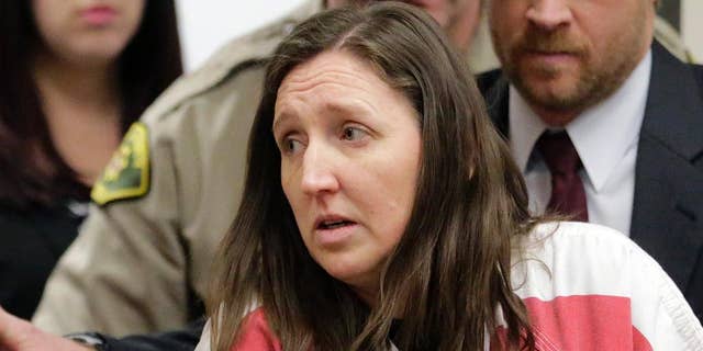 Feb. 12, 2015: In this file photo, Megan Huntsman arrives in court in Provo, Utah. Huntsman who pleaded guilty to killing six of her newborn babies and storing their bodies in her garage is set to be sentenced.