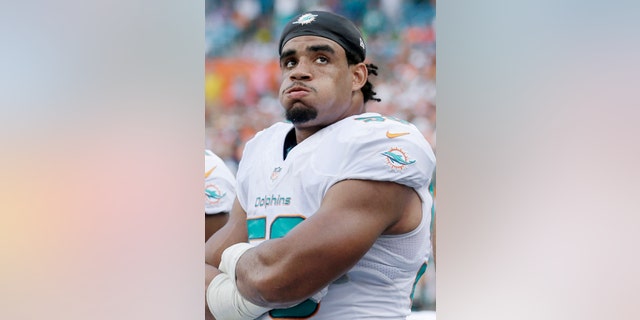 Miami Dolphins defensive end Olivier Vernon watches during the final seconds of an NFL football game against the Buffalo Bills, Sunday, Oct. 20, 2013, in Miami Gardens, Fla. The Bills defeated the Dolphins 23-21. (AP Photo/Wilfredo Lee)