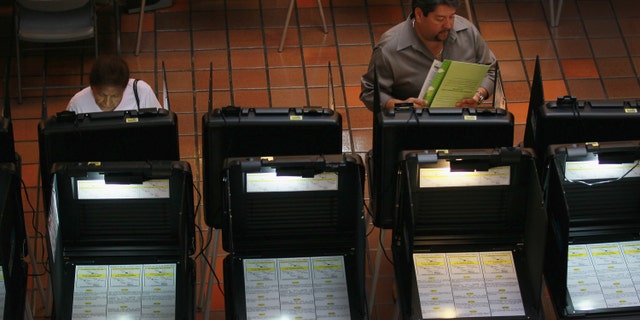MIAMI, FL - MAY 09: Early voters fill out their ballots as they cast their votes before the general election date scheduled for May 24th, during the special election to select a new Miami-Dade mayor on May 9, 2011 in Miami, Florida. The former mayor Carlos Alvarez was voted out of office by voters unhappy with a property tax rate increase and the fact that he gave salary raises to county employees during a deep recession. The vote to oust the former mayor made Miami-Dade the most populous area ever to recall a local official. 11 candidates are running for the open seat. (Photo by Joe Raedle/Getty Images)