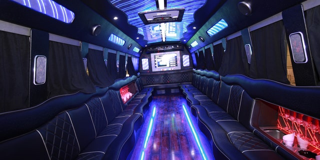 A big party bus filled with comfortable seats, and shiny bright floor for dancing and having fun.