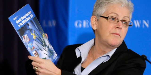 Feb. 21, 2013: Gina McCarthy, then-Assistant Administrator with the Environmental Protection Agency and current Administrator, holds a climate change report as she speaks at a climate workshop sponsored by The Climate Center at Georgetown University.