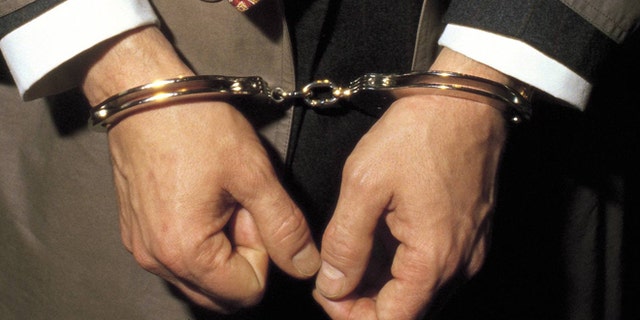 Person under arrest with handcuffs Detail of the handcuffed hands of a man under arrest (Photo by Matias Nieto/Cover/Getty Images)