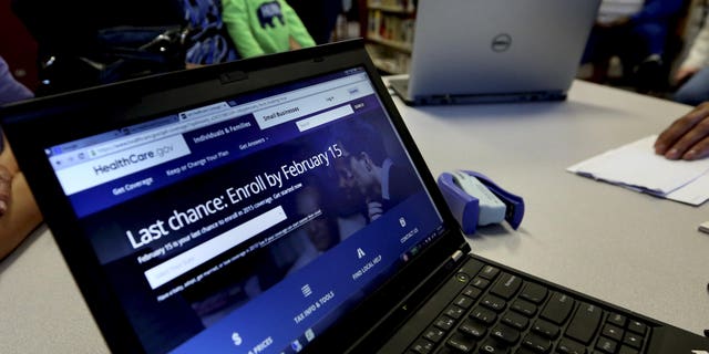 In this Thursday, Feb. 12, 2015 photo, a laptop shows the HealthCare.com web site during an Affordable Care Act enrollment event at the Fort Worth Public Library in Fort Worth, Texas. For the second year in a row, millions of Americans have signed up for subsidized health insurance under President Barack Obama's law. But as the 2015 sign-up season draws to a close Sunday, the future of the Affordable Care Act remains in doubt. (AP Photo/LM Otero)