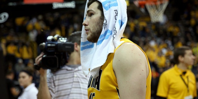 Iowa forward Zach McCabe walks off the floor after their 79-74 loss to Wisconsin during an NCAA college basketball game in Iowa City, Iowa, Saturday, Feb. 22, 2014. Wisconsin won 79-74. (AP Photo/Justin Hayworth)