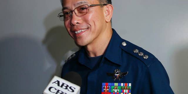 Col. Restituto Padilla, Spokesman of the Armed Forces of the Philippines, talks briefly to the media on the latest video of kidnapped Canadians, A Norwegian and a Filipino woman, as he arrives for a meeting with Foreign Affairs officials Wednesday, Nov. 4, 2015, 2015 at suburban Pasay city south of Manila, Philippines. Padilla refused to comment further except saying the military has seen the video. Suspected Abu Sayyaf gunmen have demanded more than $60 million for two Canadians and a Norwegian they are holding in the jungles of the southern Philippines in the largest ransom the Muslim militants have sought. In the video, which was circulated online by the U.S.-based SITE Intelligence Group, which monitors jihadi websites, the kidnappers and their captives say for the first time that the Abu Sayyaf was behind the Sept. 21 kidnappings. (AP Photo/Bullit Marquez)