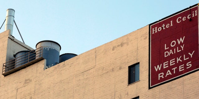 Water tanks seen on the roof of the hotel Cecil on Wednesday Feb. 20,2013 where police say the body of a woman found wedged in one of the water tanks on the roof was that of a missing Canadian guest. Investigators used body markings to identify 21-year-old Elisa Lam, police spokeswoman Officer Diana Figueroa said late Tuesday. A maintenance worker at the Cecil Hotel found the body earlier in the day after guests complained of low water pressure. (AP Photo/Nick Ut)