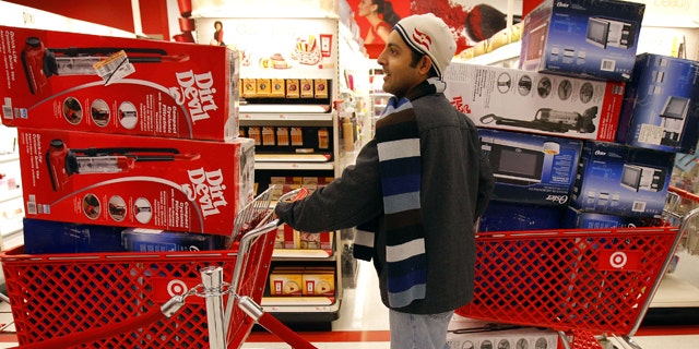 Nov. 26: A man waits in line to check out at a Target store on Black Friday in Lanesborough, Mass.