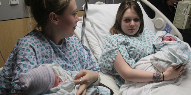 Dec. 31, 2012: Twin mothers Aimee, left, and Ashlee Nelson hold their newborn sons Donavyn Bratten, left, and Aiden Lee Alan Dilts at Summa Akron City Hospital.