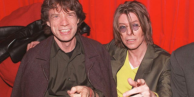 December 2, 1999. Singers David Bowie (R) and Mick Jagger (L) at POP in Soho, London.