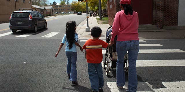 AURORA, CO - MAY 21: Undocumented Mexican immigrant Jeanette Vizguerra walks home with her three American-born children on May 21, 2011 in Aurora, Colorado. Vizguerra is facing deportation to Mexico and is scheduled for a final hearing July 13 at Denver's Federal Courthouse. Just one of millions of undocumented immigrants living in the United States, Vizguerra first came to Colorado from Mexico City with her husband 14 years before. She is a small business owner of a janitorial service and a community organizer for immigration rights. Stopped two years ago by a traffic policemen for driving with expired tags, Vizguerra was taken to jail when she could not prove she was in the country legally. Out on bail during lengthy court proceedings, she now faces the real possibility that she will be deported back to Mexico and separated from her family in the United States. (Photo by John Moore/Getty Images)