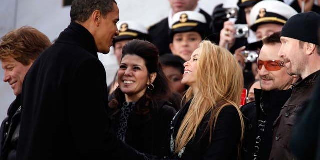 January 18, 2009: U.S. President-elect Barack Obama shakes hands with Shakira and Marisa Tomei, Bono and the Edge in front of the Lincoln Memorial during the 'We Are One: The Obama Inaugural Celebration At The Lincoln Memorial' at the National Mall in Washington, DC. The event includes a diverse array of talent featuring both musical performances and historical readings and an appearance by U.S. President-elect Barack Obama.