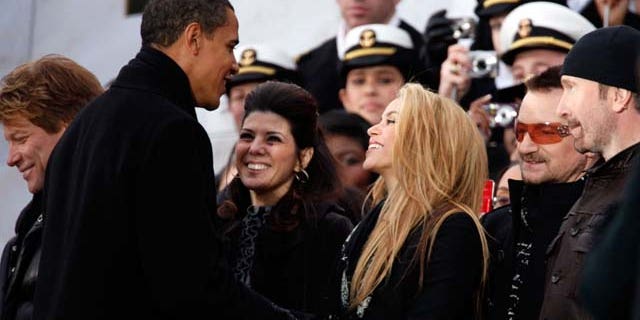 January 18, 2009: U.S. President-elect Barack Obama shakes hands with Shakira and Marisa Tomei, Bono and the Edge in front of the Lincoln Memorial during the 'We Are One: The Obama Inaugural Celebration At The Lincoln Memorial' at the National Mall in Washington, DC. The event includes a diverse array of talent featuring both musical performances and historical readings and an appearance by U.S. President-elect Barack Obama.
