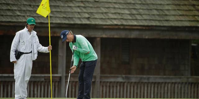 Bernhard Langer, of Germany, putts on the 11th green during a practice round for the Masters golf tournament Tuesday, April 8, 2014, in Augusta, Ga. (AP Photo/Chris Carlson)