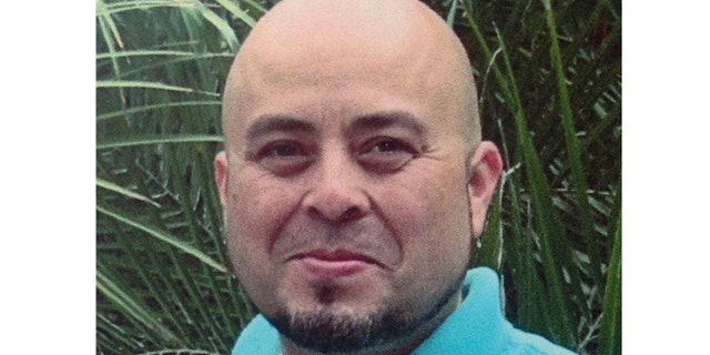 This June 2013 file photo released by the Hernandez family Nov. 2, 2013, shows Transportation Security Administration officer Gerardo Hernandez.
