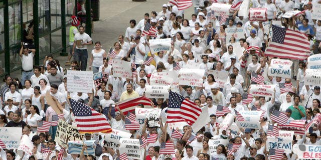 Marchers in support of immigration reform walk the streets of Indianapolis, Tuesday, May 1, 2007. Marches and rallies took place in dozens of cities across the United States. (AP Photo/AJ Mast)