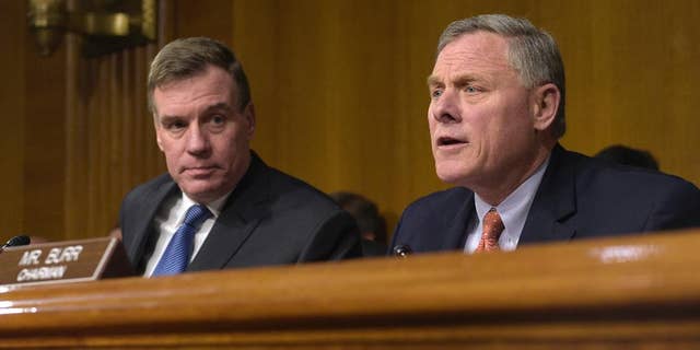 Senate Intelligence Committee Chairman. Sen. Richard Burr, R-N.C., right, joined by Vice Chairman Sen. Mark Warner, D-Va., left, at a Senate Intelligence Committee hearing on Capitol Hill in Washington, Thursday, March 30, 2017. (AP Photo/Susan Walsh)
