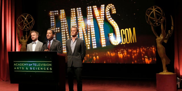 Actor Aaron Paul, Academy of Television Arts & Sciences Chairman and CEO Bruce Rosenblum and actor Neil Patrick Harris announce the 2013 Emmy nominations on July 18, 2013, in North Hollywood, Calif.