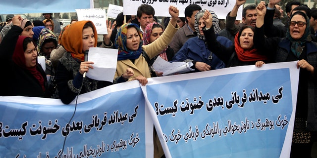 Feb. 23, 2015: Afghanistan civil society activists participate in a demonstration to protest the increasing violence against women in their country, in front of the High Court in Kabul, Afghanistan. Writing on the posters reads: "Who knows who will be the next victim of violence?," "We want the rapists to receive punishment," and "to fight against violence we need a strong decision."
