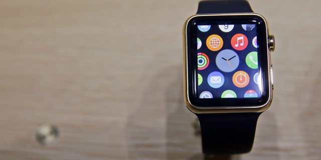 A variety of the Apple Watch is on display in the demo room after an Apple event on Monday, March 9, 2015, in San Francisco. Pre-orders for the Apple Watch start April 10. The device costs $349 for a base model, while a luxury gold version will go for $10,000.