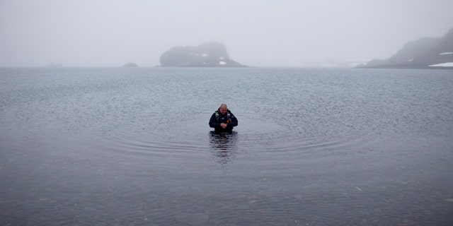FILE -- Jan. 21, 2015: Scuba diver Luis Torres tests the water at Chilean scientific station Escudero at Villa Las Estrellas, in King George Island, in the South Shetland Islands archipelago of Antarctica.